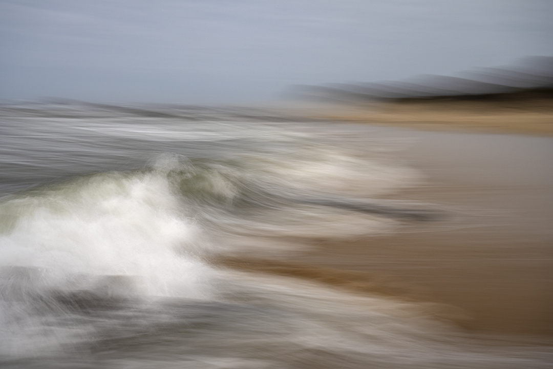 The motion of the waves as they recede from the beach